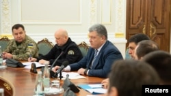 Ukrainian President Petro Poroshenko chairs a meeting of the National Security and Defense Council in Kyiv, Ukraine, Nov. 26, 2018.
