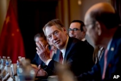U.S. Trade Representative Robert Lighthizer, pictured, accompanied by Trump administration officials, speaks as they meet with Chinese Vice Premier Liu He and other Chinese officials at the White House, Jan. 30, 2019.