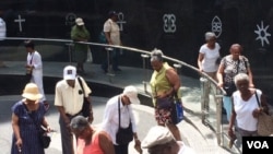 New Yorkers and tourists visit the African Burial Ground National Monument in New York City. (Credit: Adam Phillips)