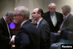 FILE - Republican state Sen. Clyde Chambliss, center, is seen with other senators during a vote on the strictest anti-abortion bill in the United States, at the Alabama Legislature in Montgomery, May 14, 2019.