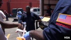 The pantry at the Dallas International Street Church offers food to the needy of South Dallas. The unemployed come for food, regardless of race, because love is love, "not a color." (M. O'Sullivan/VOA)