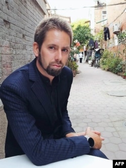 This undated photo at an undisclosed location provided to AFP by the 'Chinese Urgent Action Working Group' shows Swedish human rights activist Peter Dahlin.
