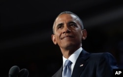 FILE - President Barack Obama pauses as he speaks during 2016 Democratic National Convention in Philadelphia, July 27, 2016.