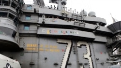 International observers including from Australia, South Korea and Japan watch aircraft operations on USS George Washington during military manoeuvre exercises, known as Keen Sword 15.
