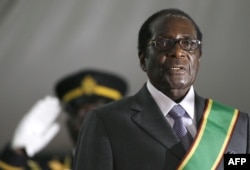 FILE - Zimbabwean President Robert Mugabe is sworn in for a sixth term in office in Harare, June 29, 2008.