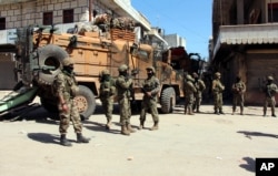 Turkish soldiers, positioned in the city center of Afrin, northwestern Syria, March 19, 2018, a day after they took the control of the area.