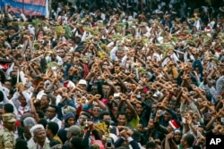 FILE - Protesters chant slogans against the government during a march in Bishoftu, in the Oromia region of Ethiopia, Oct. 2, 2016