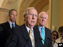 Senate Republican Majority Leader Mitch McConnell, center, joined by fellow Republican senators, holds a news conference at the Capitol after President Donald Trump overruled congressional Republicans and his own treasury secretary and cut a deal with Democrats to fund the government and raise the federal borrowing limit for three months, all part of an agreement to speed money to Harvey relief, in Washington, Sept. 6, 2017.