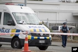 A police officer stands guard outside the Linwood mosque in Christchurch, New Zealand, March 19, 2019.