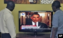 Kenyans in Nairobi watch President Obama announce the death of bin Laden.