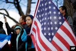 FILE - Demonstrators gathered in Baltimore, Maryland, Feb. 16, 2017, as part of a nationwide "A Day Without Immigrants" protest.