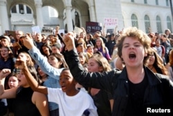 People gather to protest the election of Republican Donald Trump as the president of the United States outside of City Hall in Los Angeles, California, Nov. 9, 2016.