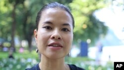 Bach Ngoc Lien, a development expert, is interviewed by the Associated Press, Oct. 30, 2017, about President Donald Trump's visit to Asia in Hanoi, Vietnam.