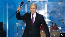 Russian President Vladimir Putin attends a concert in Sevastopol, Crimea, March 14, 2018.
