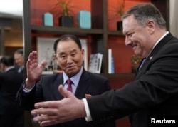 U.S. Secretary of State Mike Pompeo escorts Kim Yong Chol, North Korea's lead negotiator in nuclear diplomacy with the United States, into talks at a hotel in Washington, Jan. 18, 2019.