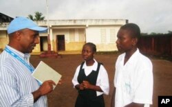 UNICEF official talking to students in Ganta, Liberia