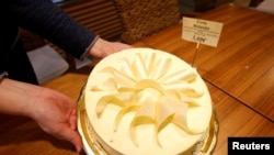 FILE - A cake named after Melania Trump is seen at coffee shop in her hometown Sevnica, Slovenia, Dec. 1, 2016.