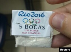 One of dozens of packages of cocaine stamped with a Rio 2016 label, the Olympic rings, and a warning that reads, "Keep away from children," confiscated by police in a raid on the Lapa neighborhood of Rio de Janeiro, July 25, 2016.
