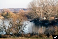 The river Evros is seen from a spot near the Greek town of Didymoteicho, at the Greek-Turkish border, Sunday, Dec. 4, 2016. A year after the uncontrolled influx of more than a million refugees and economic migrants to debt-hobbled Greece, en route to Europe.