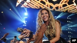 Singer Beyonce performs during her "Mrs. Carter Show World Tour 2013", June 29, 2013, in Las Vegas, Nevada.