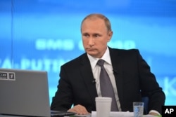 During his annual call-in show with his nation, Russian President Vladimir Putin again denies having any Russian troops fighting in eastern Ukraine.