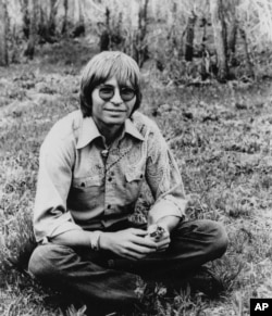 Country Western singer John Denver is shown in a 1977 handout photo. Denver, whose songs ``Rocky Mountain High'' and ``Take Me Home, Country Roads'' gained him worldwide appeal and millions of record sales in the 1970. (AP Photo/RCA, File)