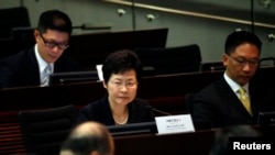 FILE - Hong Kong Chief Secretary Carrie Lam looks on during a meeting on proposing electoral reforms at the Legislative Council in Hong Kong.