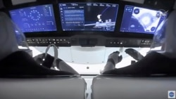 In this image from video provided by NASA, astronauts in the SpaceX Dragon capsule prepare for undocking from the International Space Station on Nov. 8, 2021.