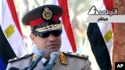 FILE- In this image taken from Egypt State TV, Egyptian army chief Abdel Fattah el-Sissi delivers a speech in Cairo, July 24, 2013.
