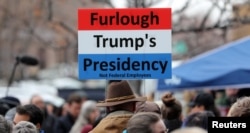 U.S. Internal Revenue Services (IRS) employees rally in front of the Federal Building against the ongoing U.S. federal government shutdown, in Ogden, Utah, U.S., Jan. 10, 2019.