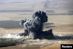 Smoke rises at Islamic State militants' positions in the town of Naweran, near Mosul, Iraq, Oct. 23, 2016.