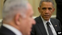 FILE - President Barack Obama listens as Israeli Prime Minister Benjamin Netanyahu speaks during their meeting in the Oval Office of the White House in Washington, Oct. 1, 2014.
