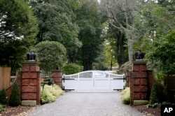 The gate is closed at the entrance to a house owned by philanthropist George Soros in Katonah, N.Y., a suburb of New York City, Oct. 23, 2018.