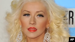 Christina Aguilera arrives at the American Music Awards at the Nokia Theatre L.A. Live on Sunday, Nov. 24, 2013, in Los Angeles.