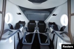 The view inside a replica Crew Dragon space craft is shown at SpaceX headquarters in Hawthorne, California, U.S. August 13, 2018. (REUTERS/Mike Blake)