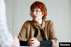 World Health Organization's Flavia Bustreo gestures during an interview in Geneva, Feb. 15, 2016.