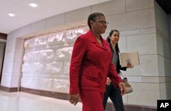 FILE - Rep. Karen Bass, D-Calif., walks through the Capitol Visitors Center on Capitol Hill in Washington.
