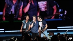 Joe Don Rooney, Gary LeVox, and Jay DeMarcus of Rascal Flatts Performs at Aarons Amphitheater on June 6, 2013, in Atlanta.