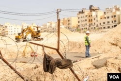 So far just over half of the $345m required has been raised, with 2200 of 5000 families rehoused. (John Owens for VOA)