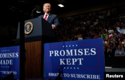 FILE - President Donald Trump holds a rally with supporters at North Side Middle School in Elkhart, Ind., May 10, 2018.