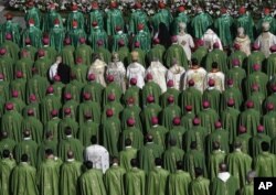 FILE - Bishops and cardinals attend a Mass officiated by Pope Francis at the opening of the Synod of Bishops, in St. Peter's Square of the Vatican, on October 3, 2018. (AP Photo / Alessandra Tarantino)