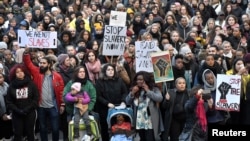 Protesters attend a demonstration against slavery in Libya, in Stockholm, Sweden, Nov. 25, 2017.