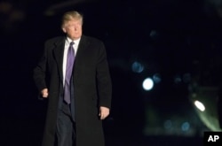 FILE - President Donald Trump walks on the South Lawn upon arrival at the White House in Washington from a trip to Florida, Feb. 12, 2017.