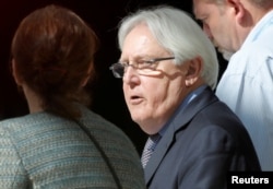 U.N. envoy Martin Griffiths walks in a hotel lobby before meeting the delegation of the government of Yemen in Geneva, Sept. 7, 2018.