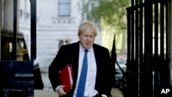 Britain's Foreign Secretary Boris Johnson arrives for a cabinet meeting at 10 Downing Street in London, Tuesday, May 1, 2018.
