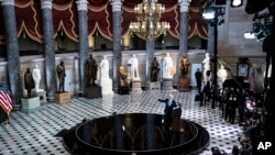 President Joe Biden speaks from Statuary Hall at the U.S. Capitol to mark the one year anniversary of the Jan. 6 riot at the Capitol by supporters loyal to then-President Donald Trump, Thursday, Jan. 6, 2022, in Washington.