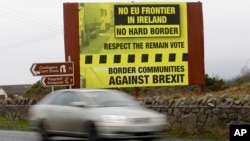 FILE - A car crosses the border from the Irish Republic into Northern Ireland, Jan. 30, 2017.