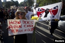 FILE - People take part in "Black Lives Matter" march around Emanuel African Methodist Episcopal Church in Charleston, June 20, 2015.