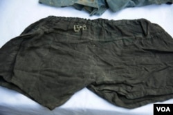 Remaining textiles of Toul Sleng victims are shown during the signing off ceremony on the conservation of objects at Toul Sleng Genocide Museum on Dec. 11, 2017. (T. Malis/VOA Khmer)