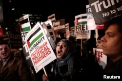 Protesters demonstrate outside the U.S. embassy against President Donald Trump's decision to recognize Jerusalem as Israel's capital, in London, Dec. 8, 2017.